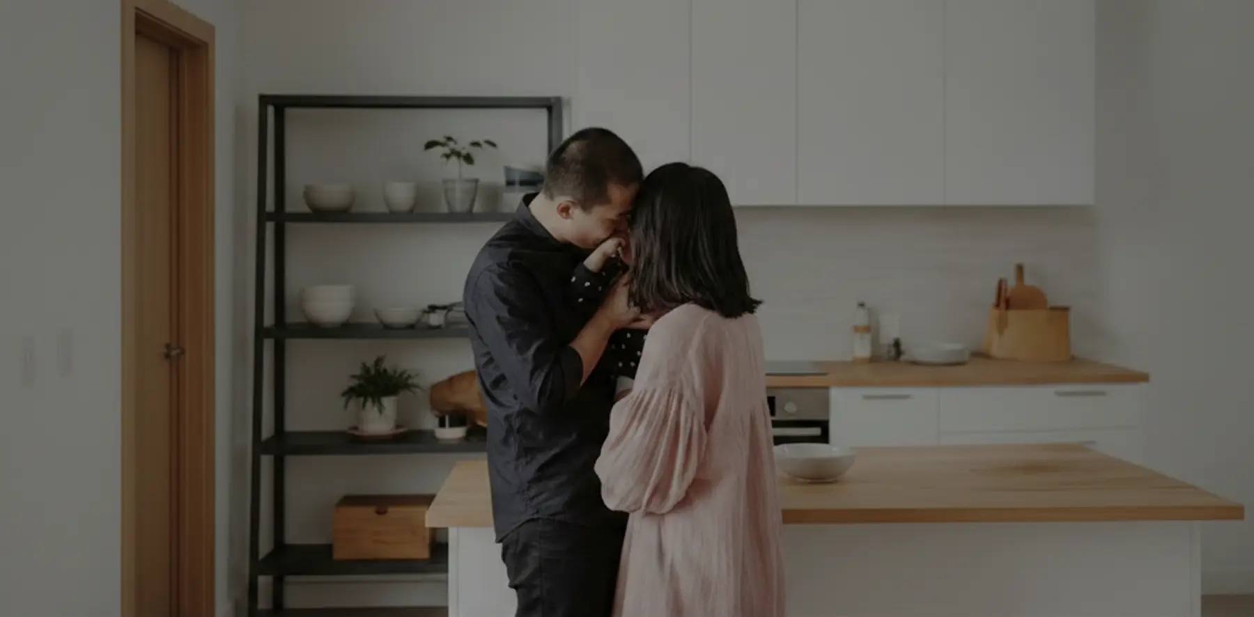 Couple hugging their son